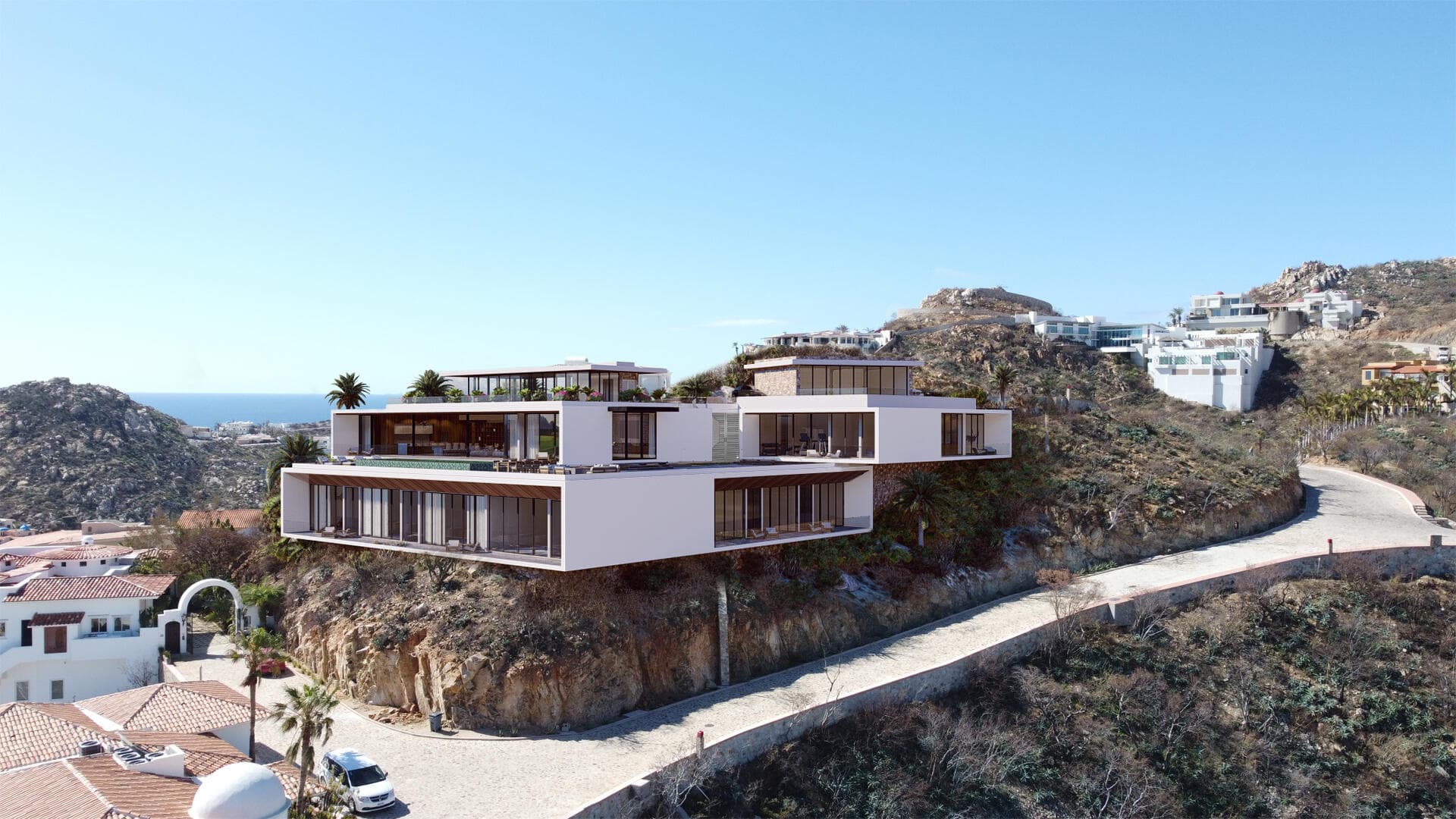 Villa del León daytime cliffside in Pedregal with pool terrace and desert hillside