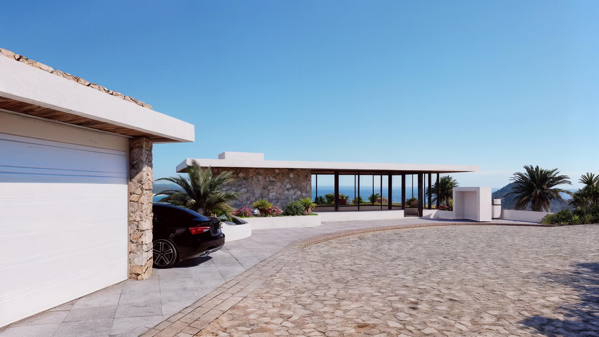 Villa del León entrance pavilion in Pedregal looking through glass toward the Cabo ocean
