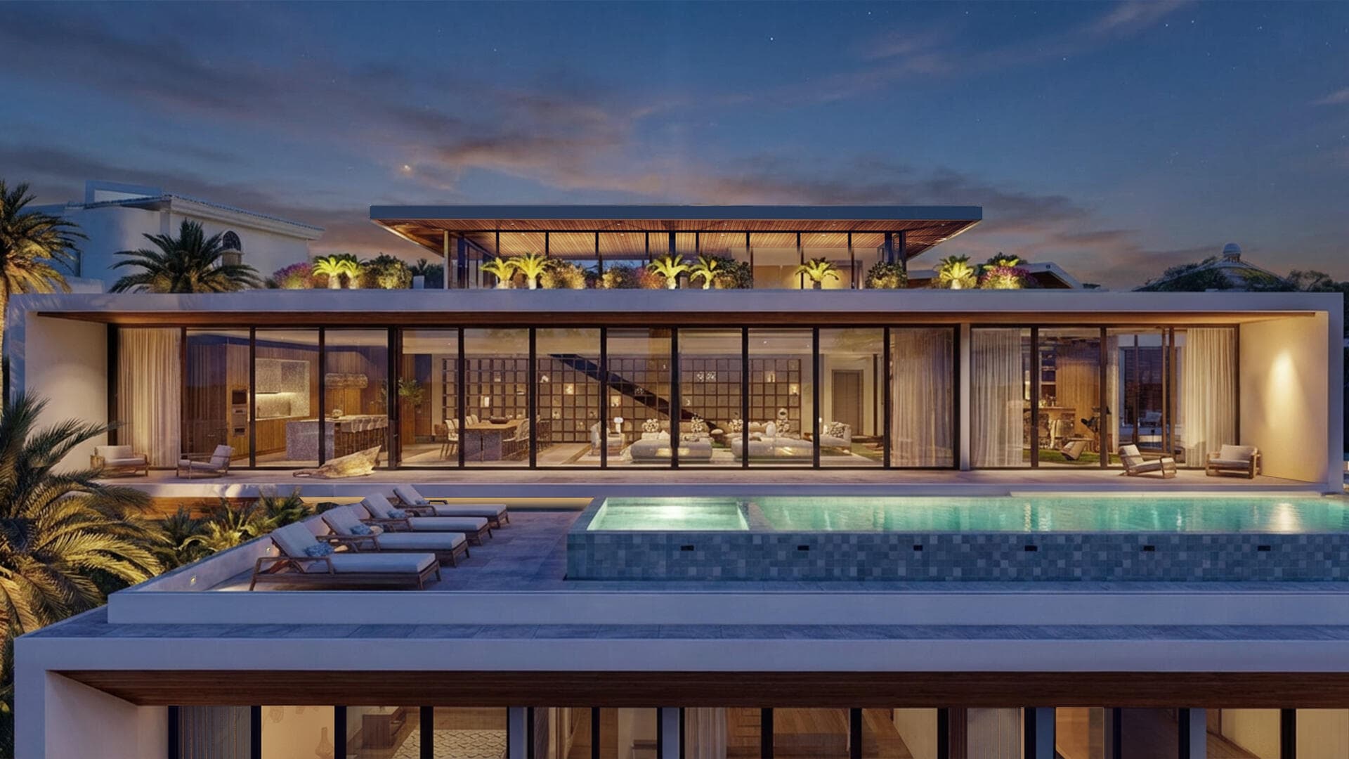 Villa del León at dusk in Pedregal, Cabo San Lucas — infinity pool and glowing interiors