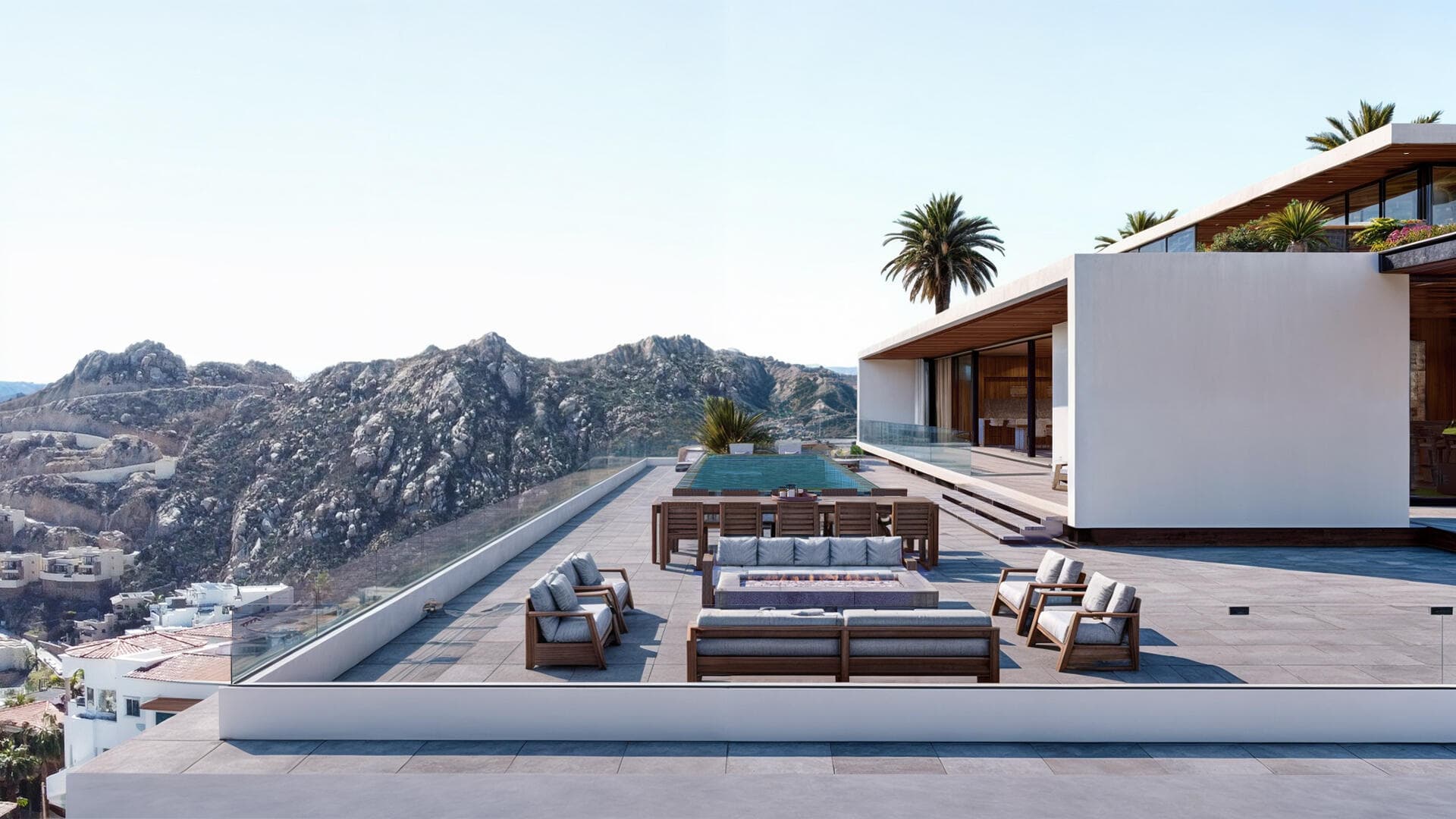 Villa del León terrace by day in Pedregal — fire pit, dining, pool, mountain view