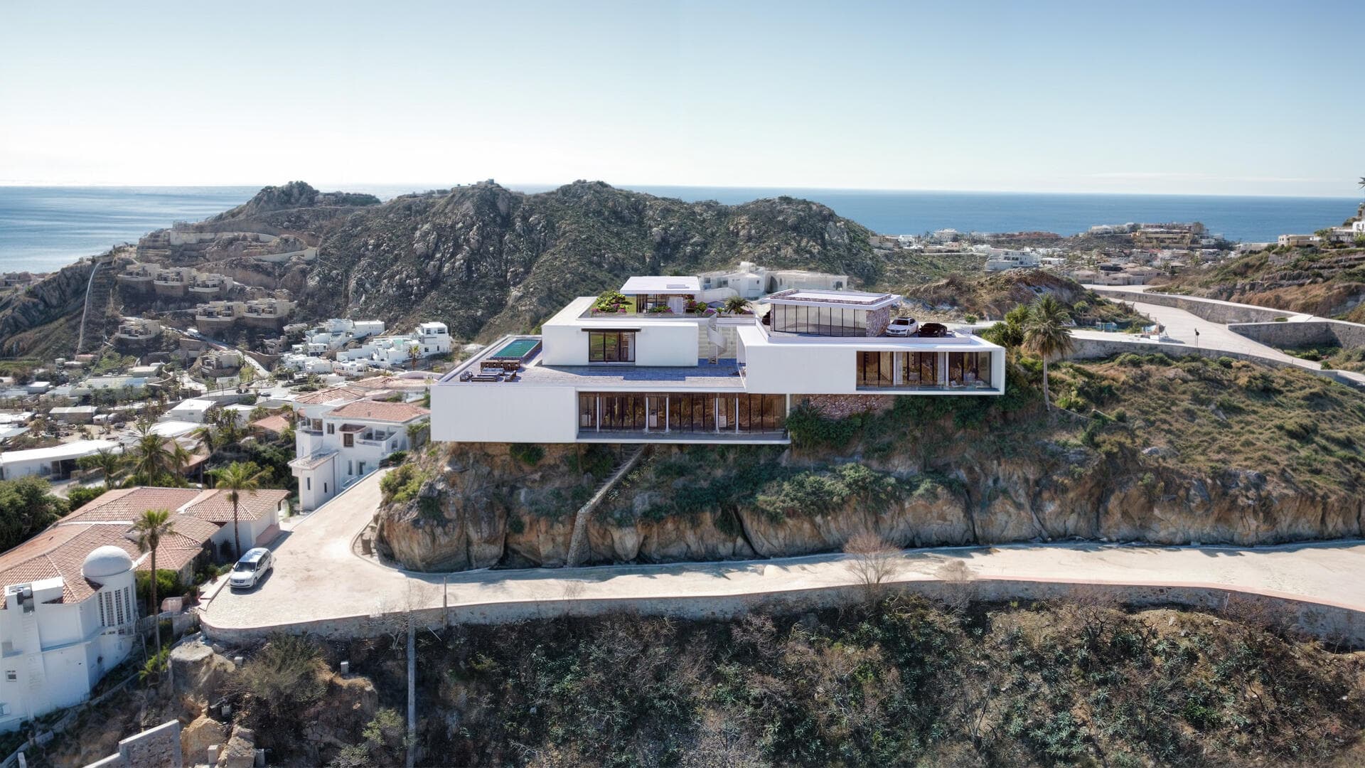 Villa del León cliffside elevation in Pedregal, Cabo — ocean, pool, and rooftop parking