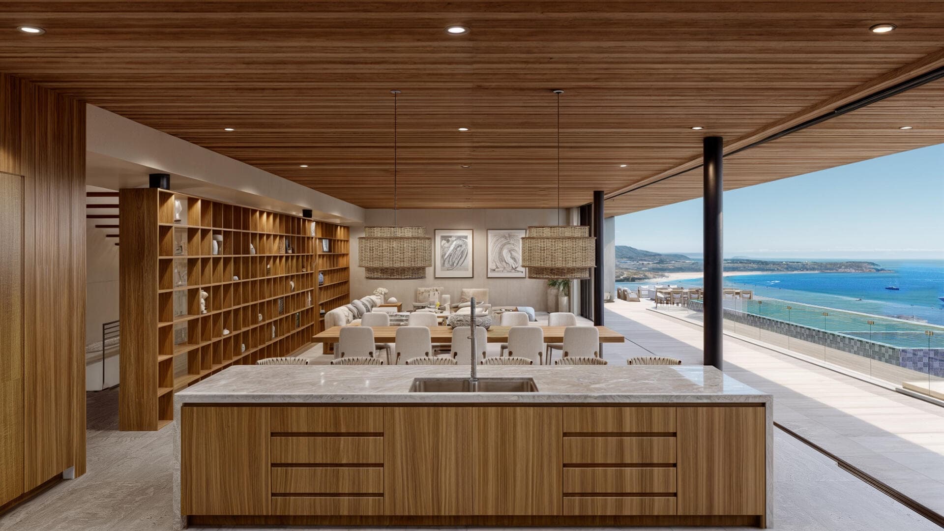 Villa del León kitchen in Pedregal, Cabo — island, dining table, and terrace with pool