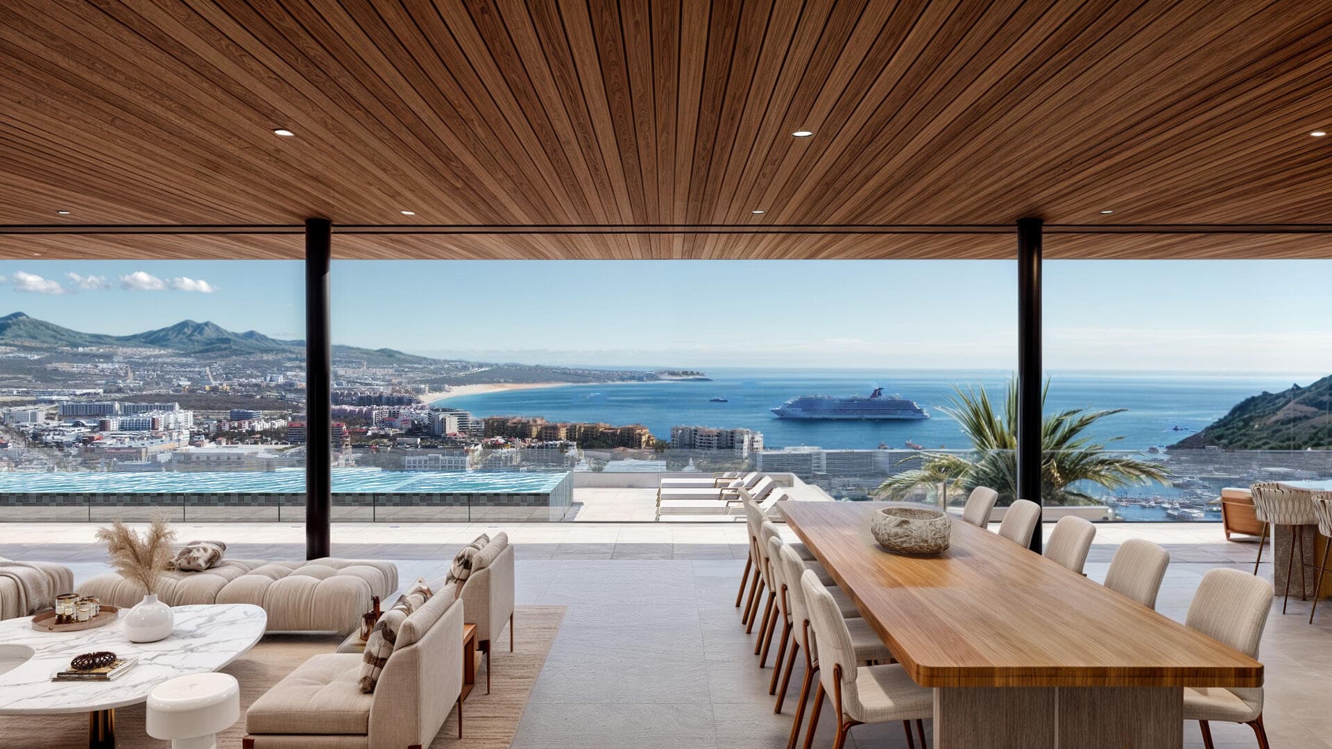 Villa del León living and dining opening to the pool and the Cabo marina